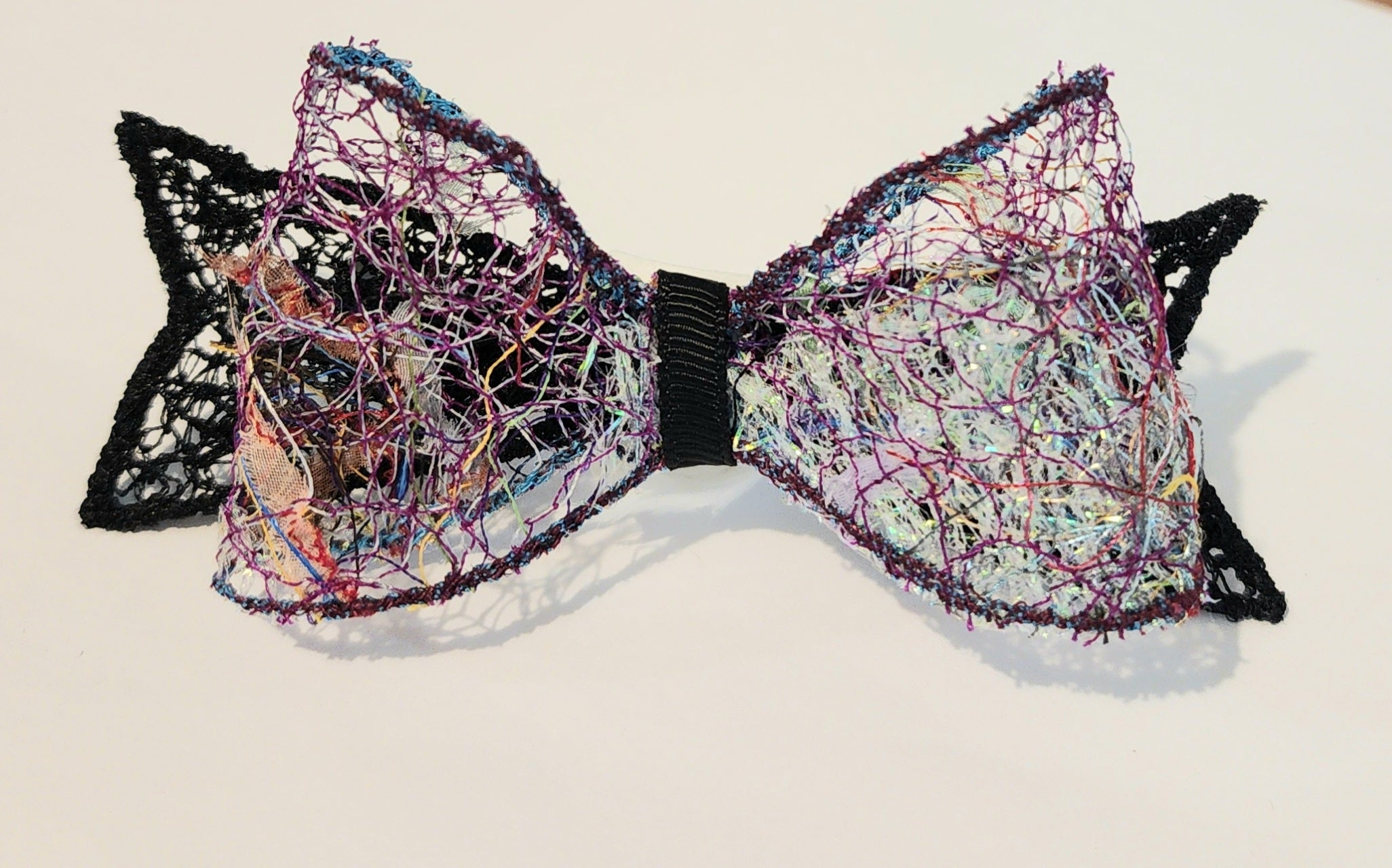 B-BLK-4, Bow Barrette. Fabric made by Free Motion Embroidery. Lacy and Unique