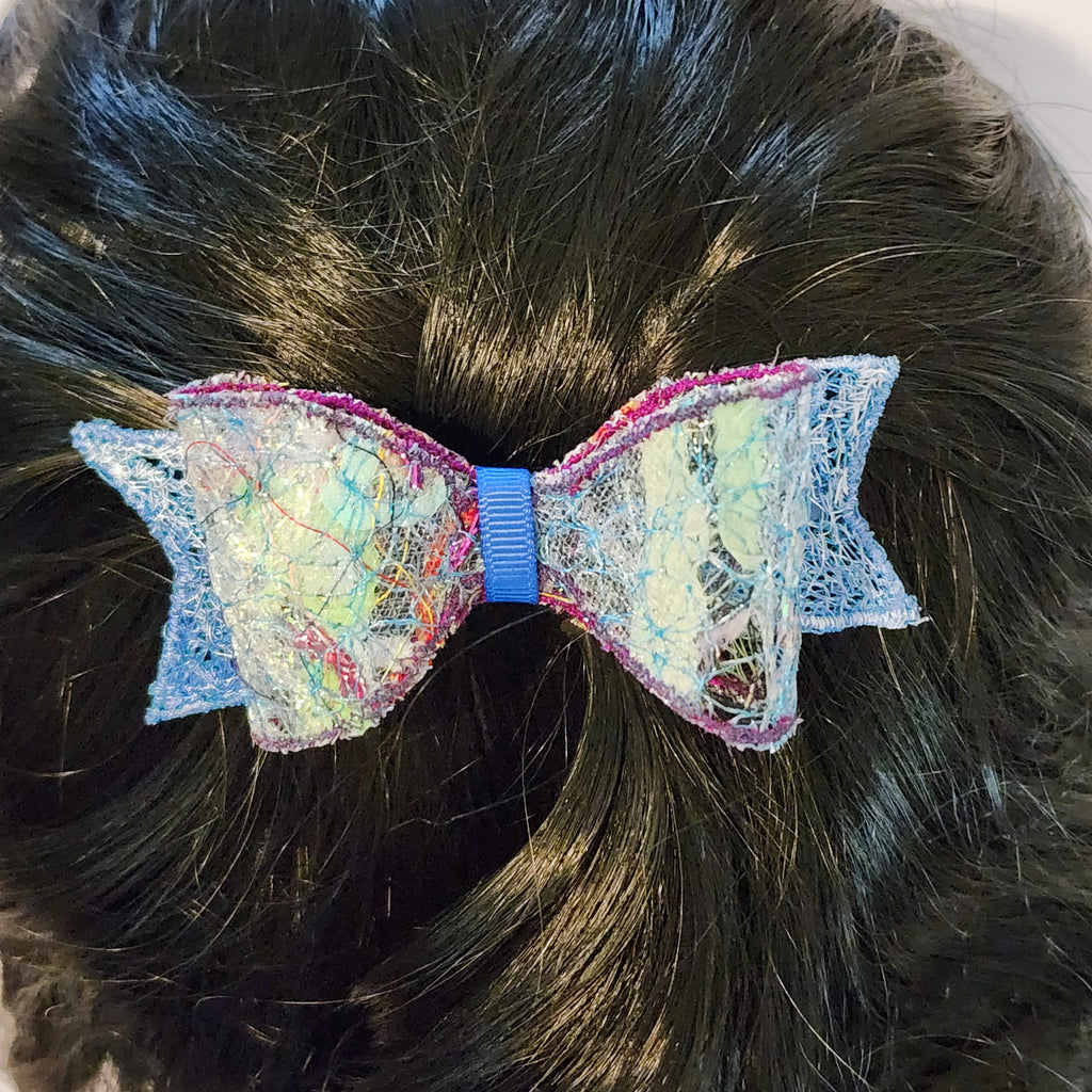 B-BLU-1, Bow Barrette. Fabric made by Free Motion Embroidery. Lacy and Unique