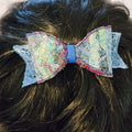 B-BLU-1, Bow Barrette. Fabric made by Free Motion Embroidery. Lacy and Unique