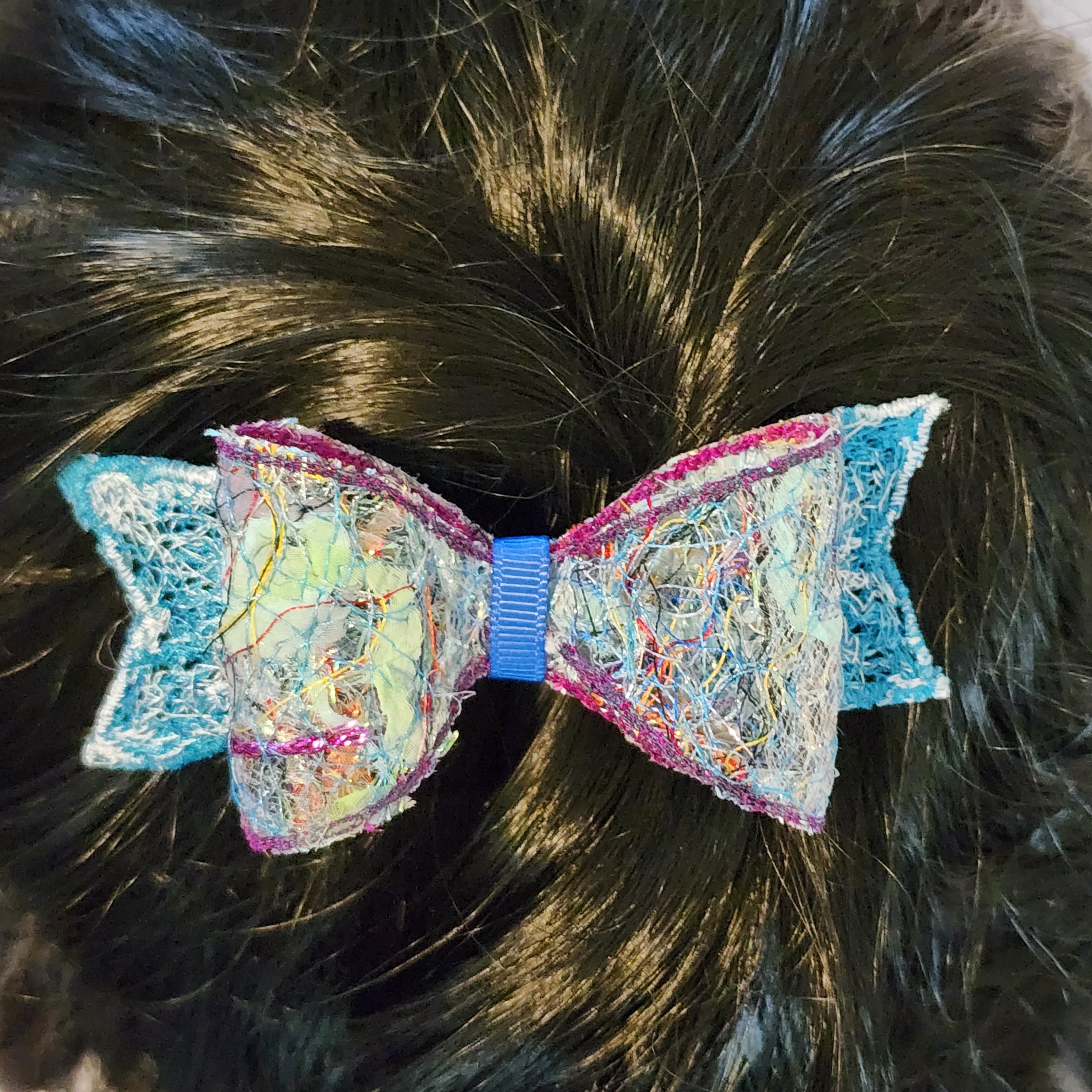 B-BLU-2, Bow Barrette. Fabric made by Free Motion Embroidery. Lacy and Unique