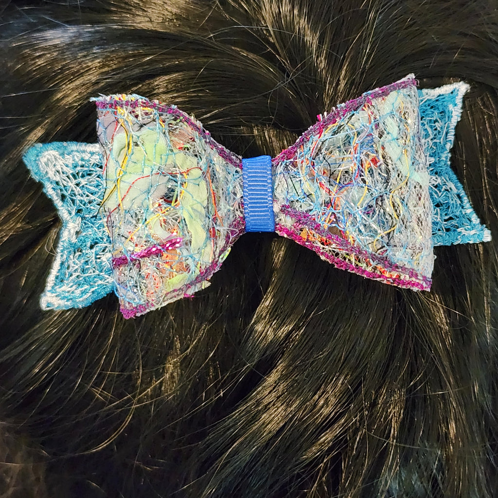 B-BLU-2, Bow Barrette. Fabric made by Free Motion Embroidery. Lacy and Unique