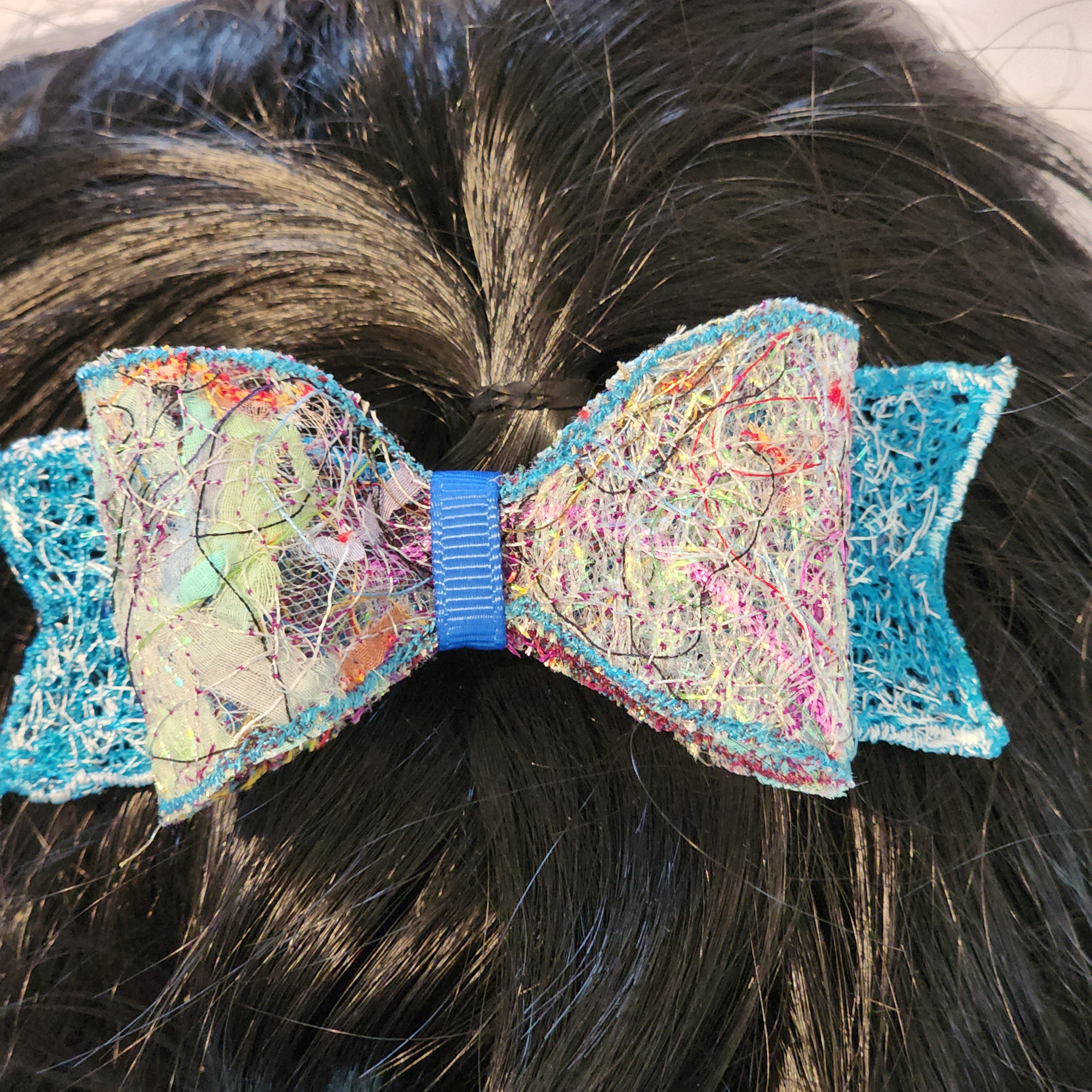B-BLU-4, Bow Barrette. Fabric made by Free Motion Embroidery. Lacy and Unique