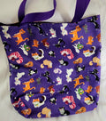 Purple bag with cartoon cat pattern on a white background