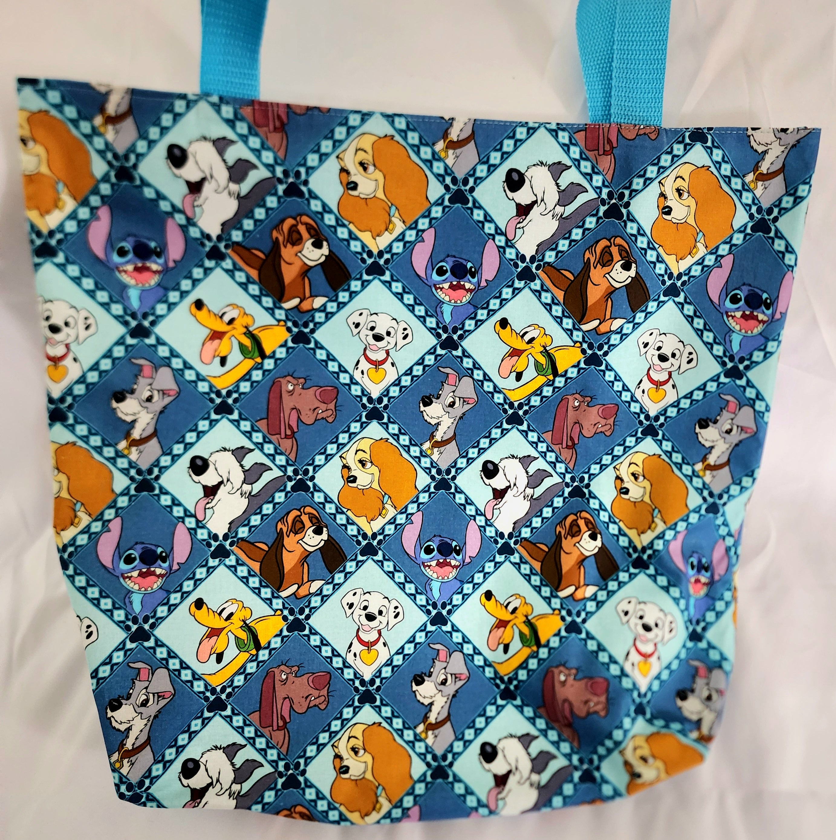 Tote bag with cartoon dog pattern on a white background