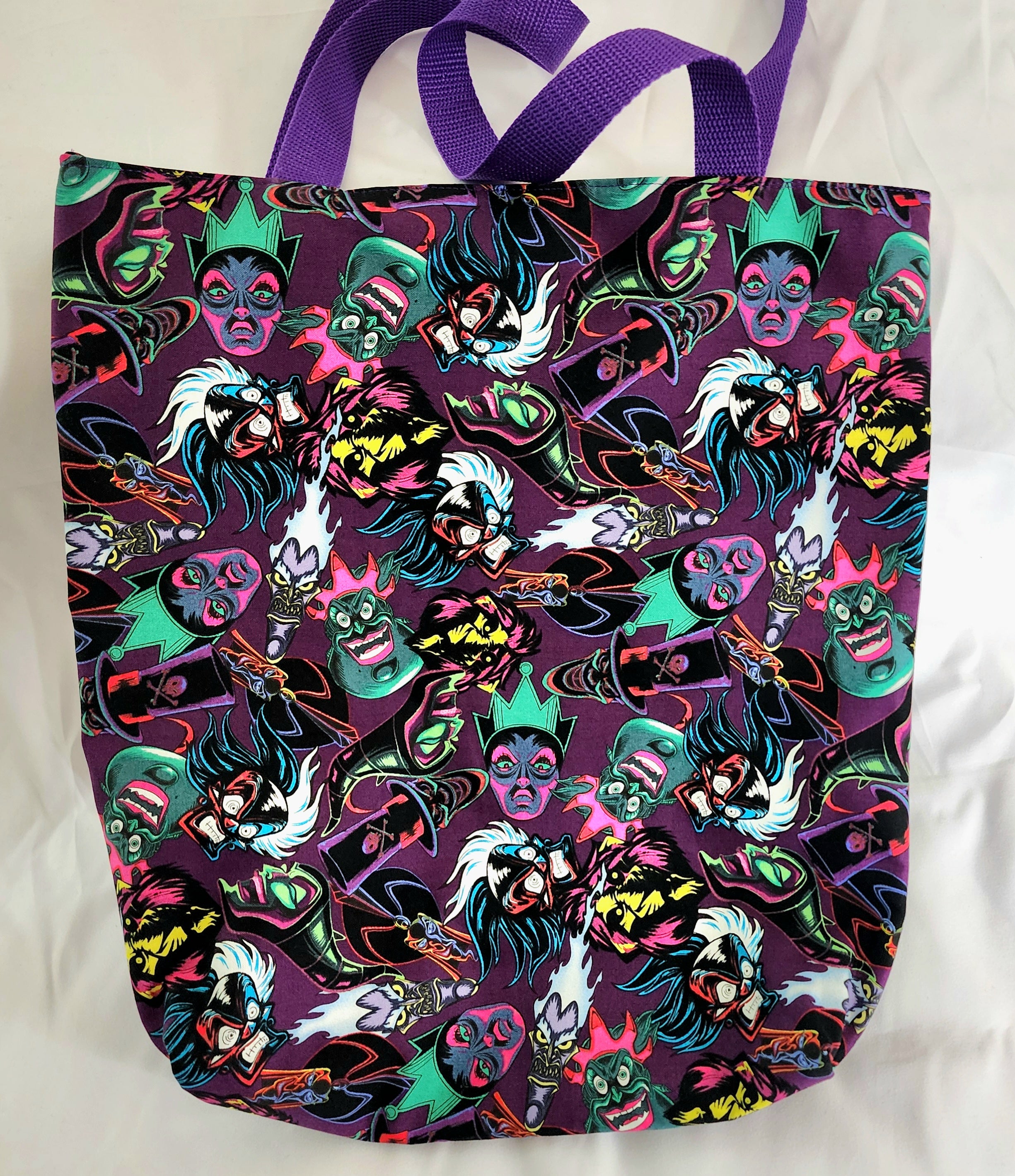 Tote bag with colorful character pattern on a white background