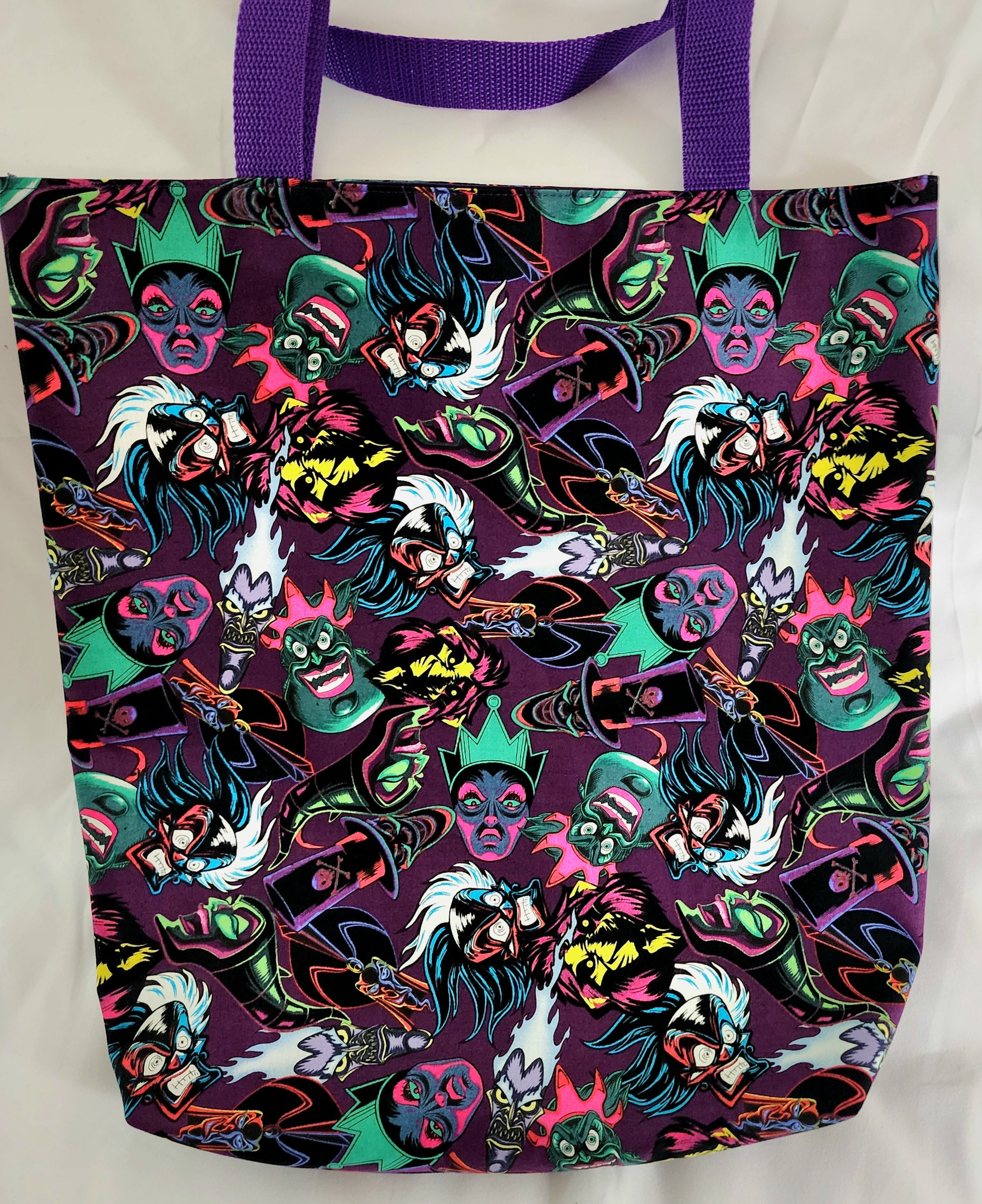 Tote bag with colorful character pattern on a white background