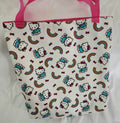 Tote bag with Hello Kitty pattern and pink handles on a white background