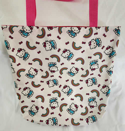 Tote bag with Hello Kitty pattern and pink handles on a white background