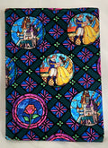 Stylized notebook cover with stained glass design featuring characters and castles.