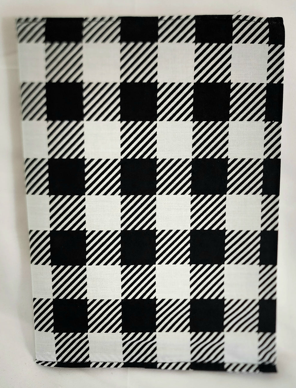 Black and white checkered book cover on a white background