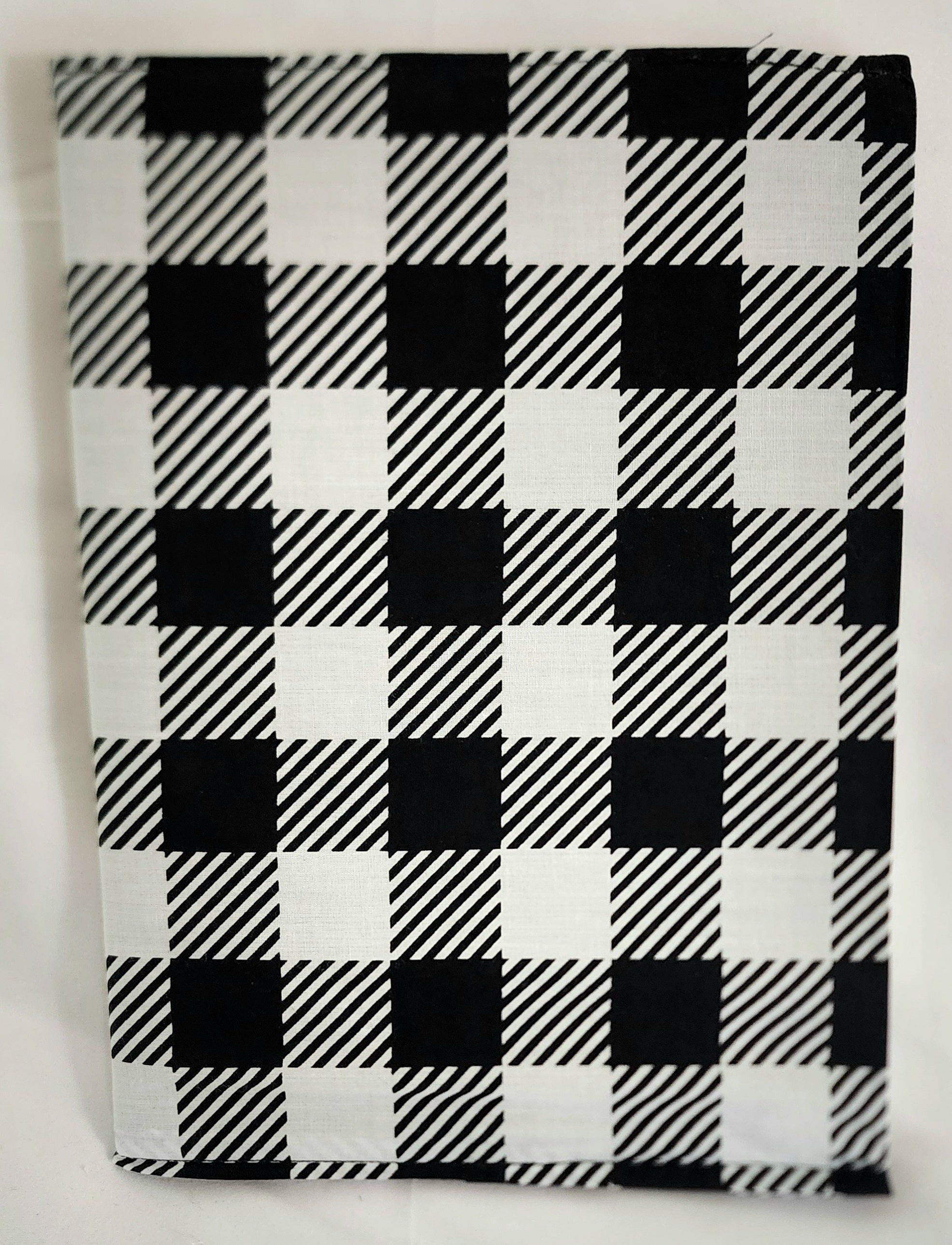 Black and white checkered book cover on a white background