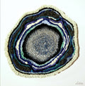 Circular artwork with concentric layers of colors on a white background