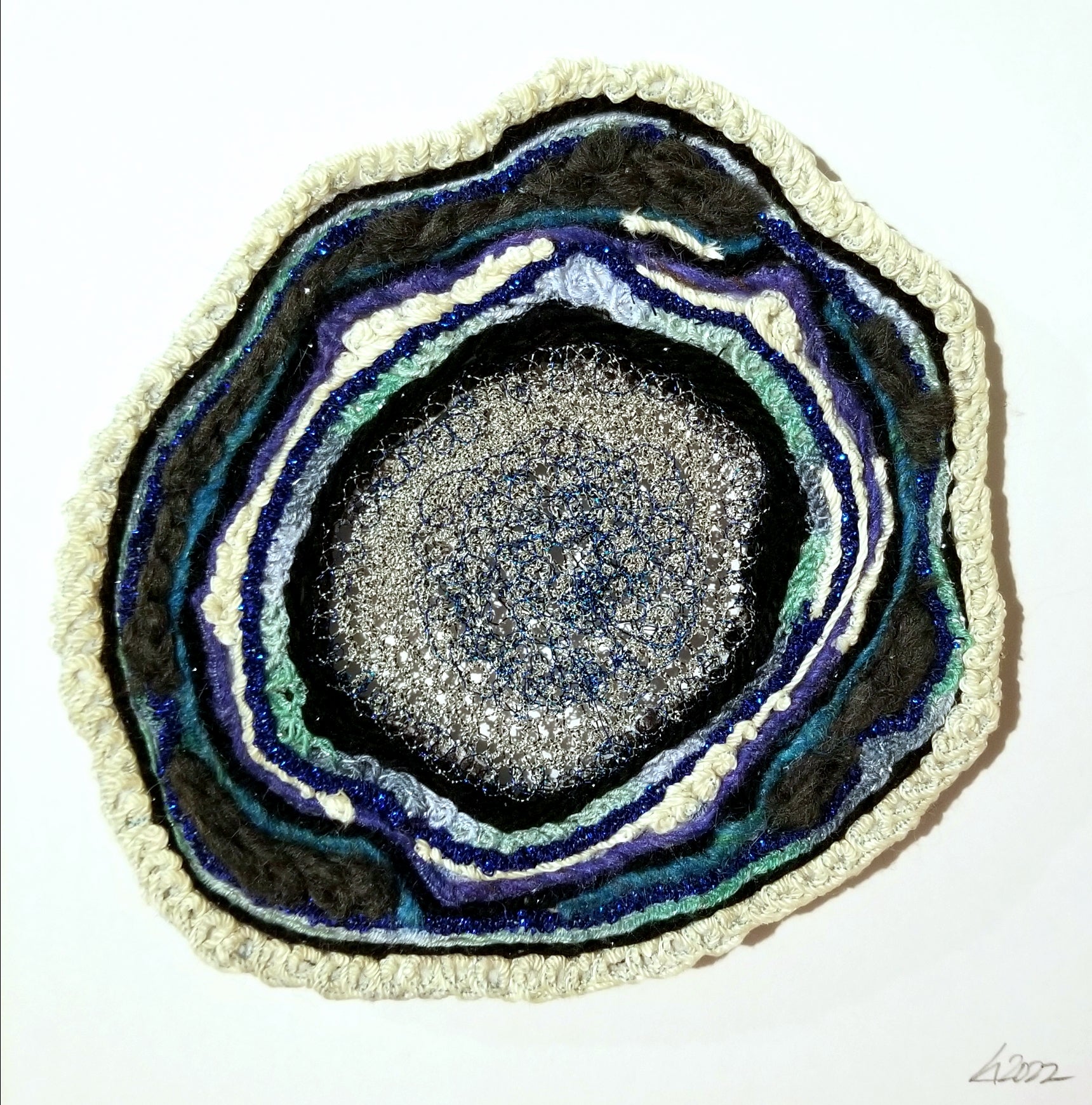Circular artwork with concentric layers of colors on a white background