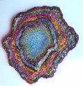 Multicolored textured circular object on a white background