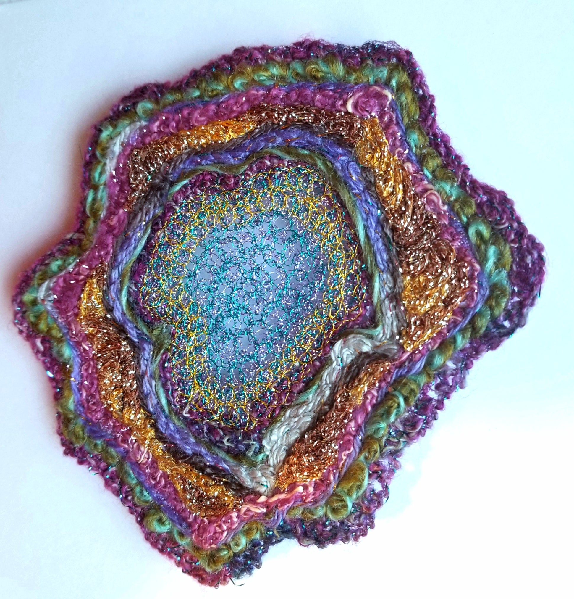 Multicolored textured circular object on a white background