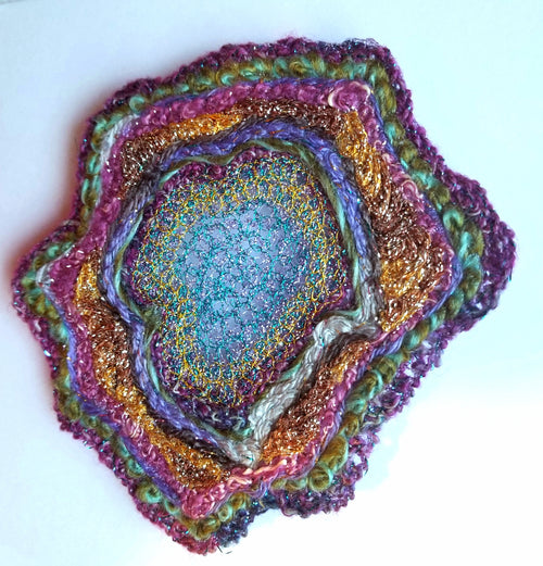 Multicolored textured circular object on a white background