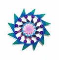 Mandala with blue, green, purple, and pink colors on a white background
