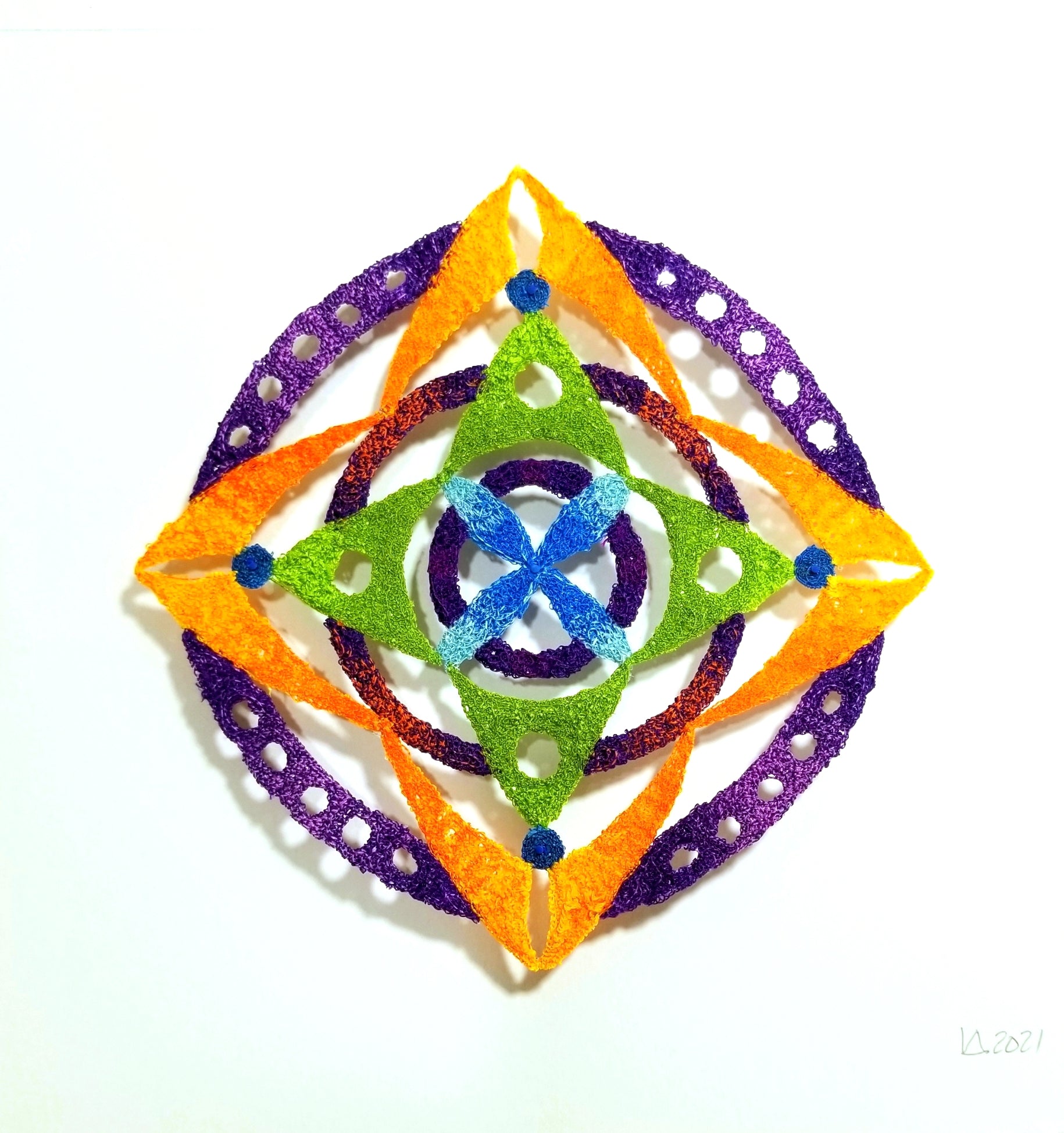 Colorful geometric star-shaped object on a white background