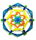Mandala geometric pattern with blue, yellow, and orange colors on a white background