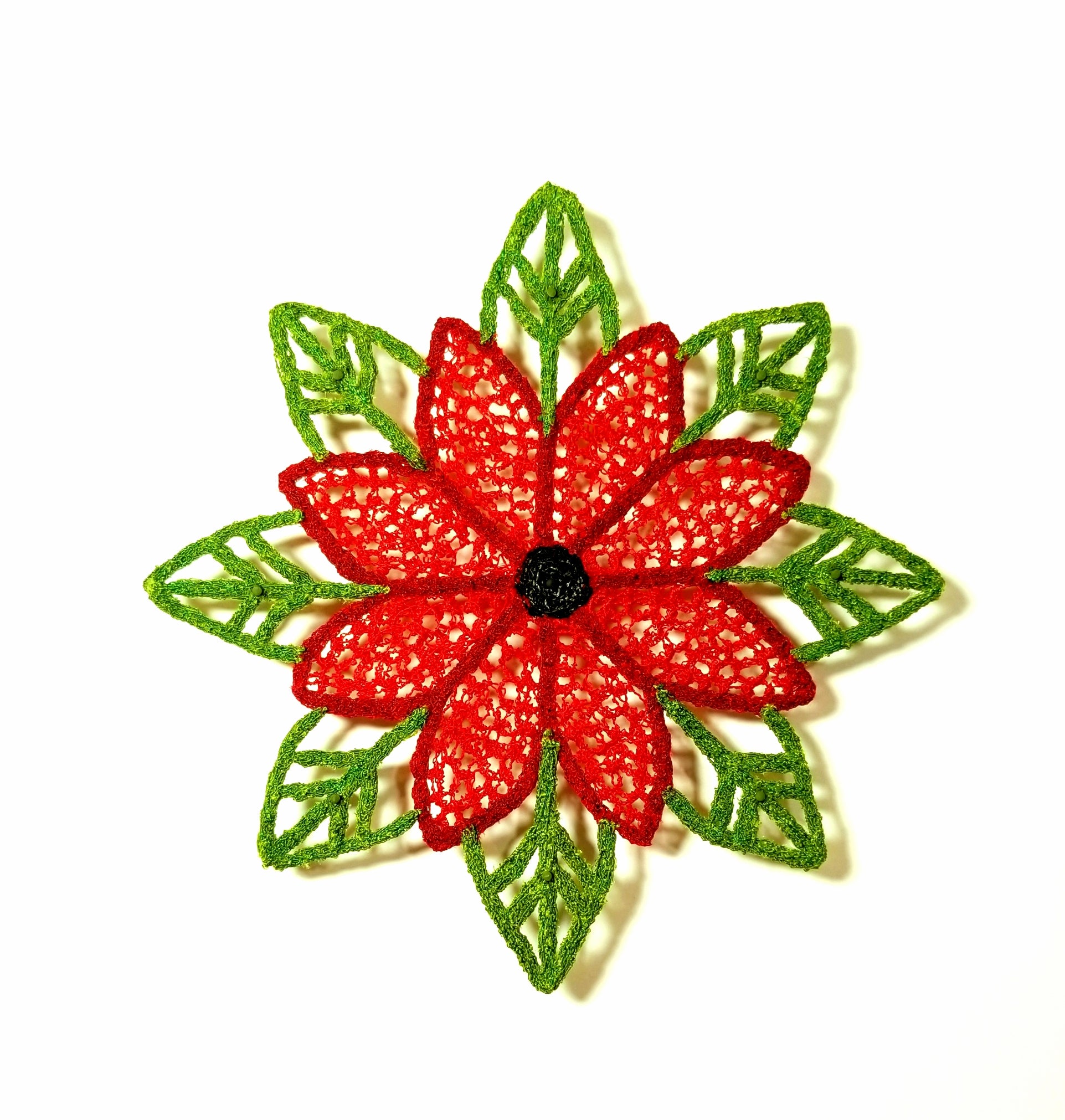 Red flower with green leaves on a white background