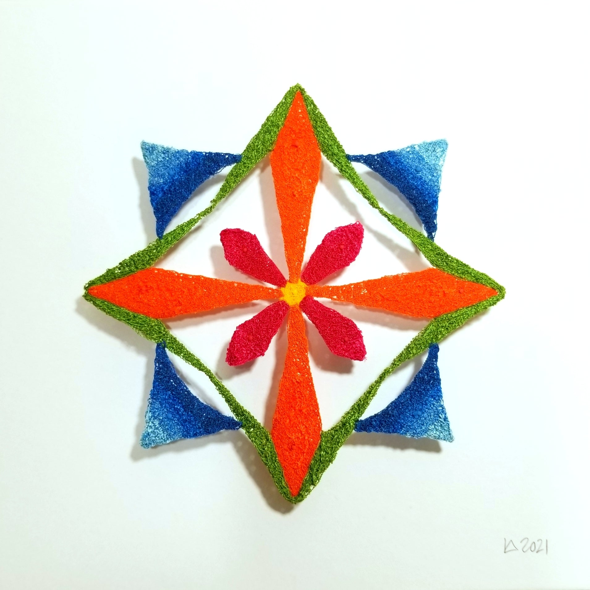 Colorful geometric star-shaped object on a white background