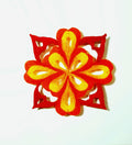 Decorative flower-shaped object with red and yellow colors on a white background
