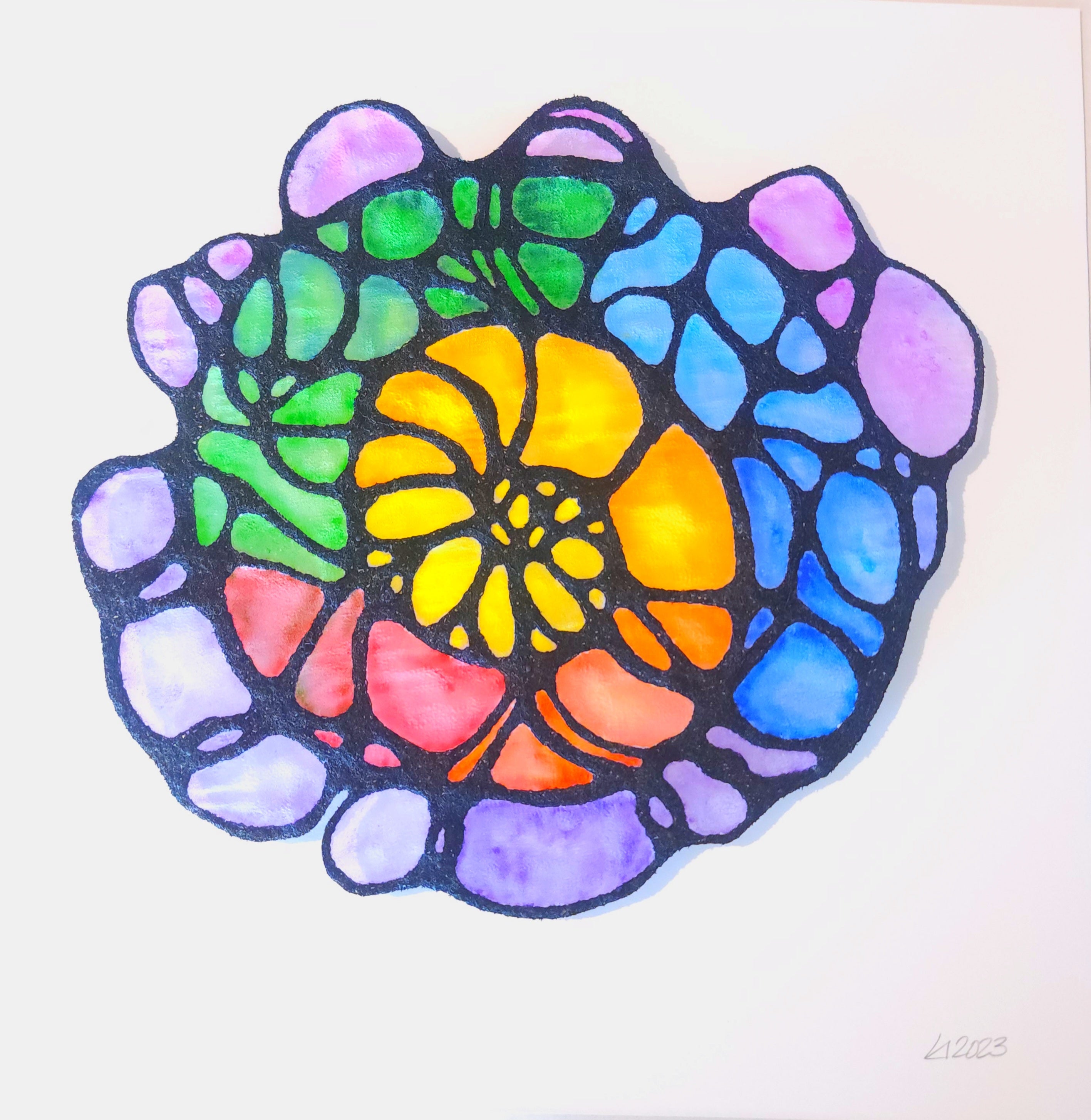Colorful circular design with a central yellow flower-like pattern on a white background