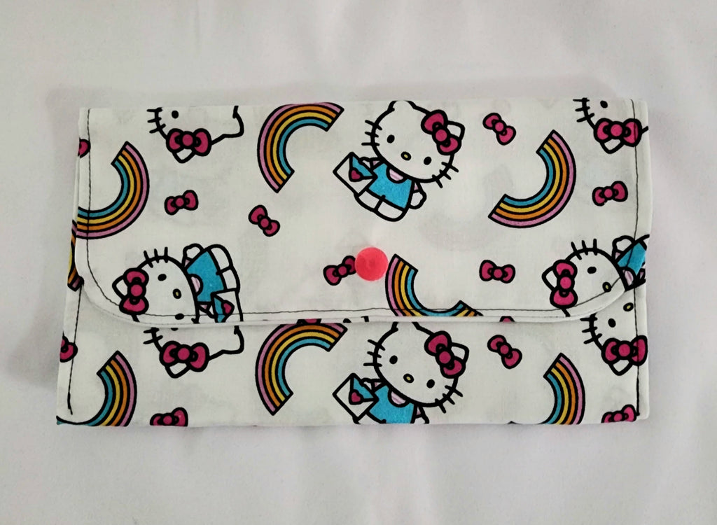 Flap bag with Hello Kitty and rainbow design on a white background