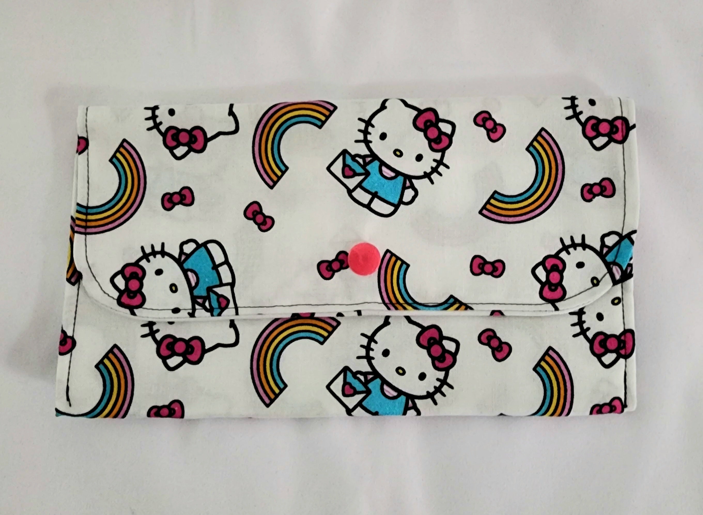 Flap bag with Hello Kitty and rainbow design on a white background