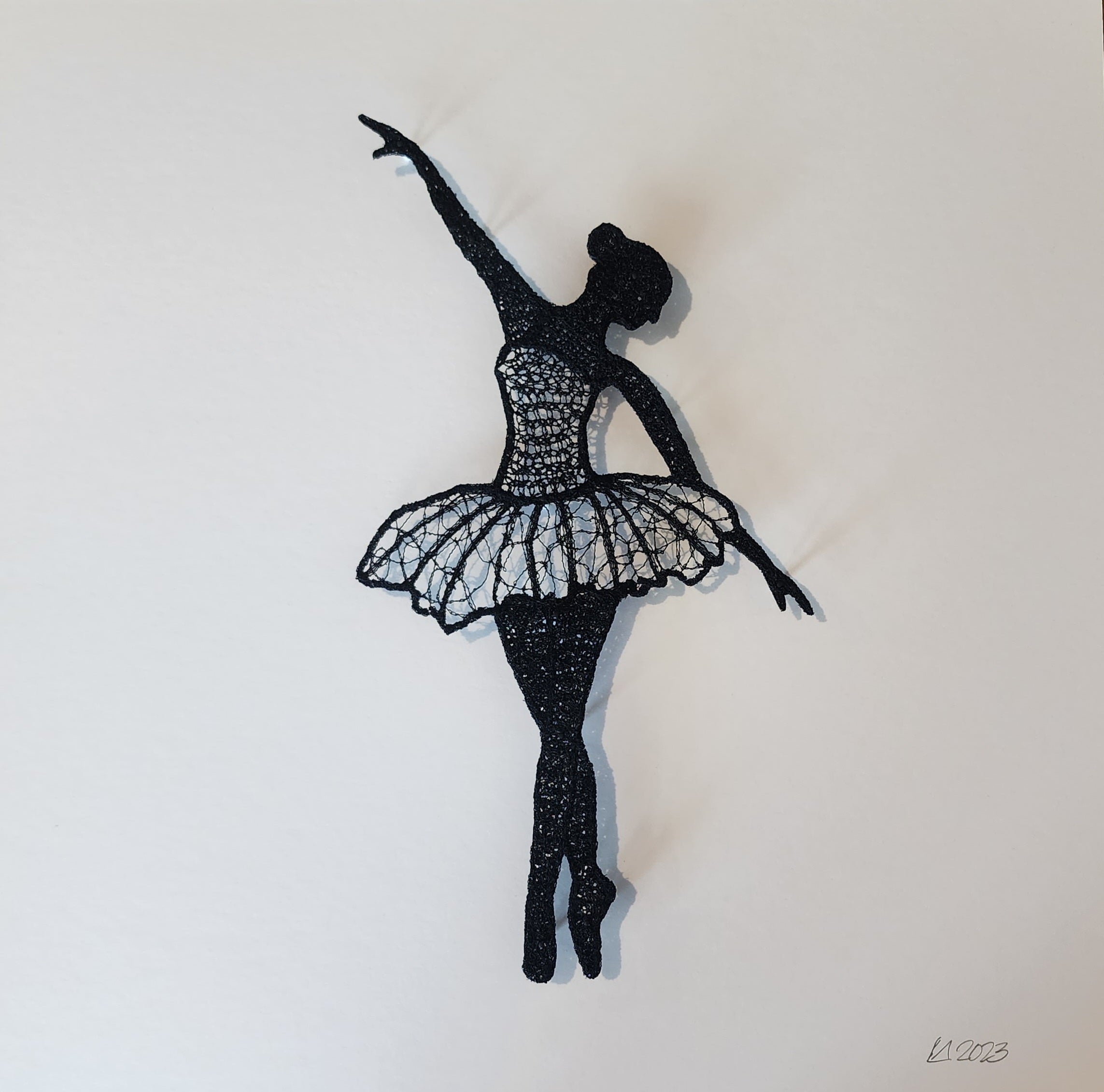 Silhouette of a ballerina dancer on a white background