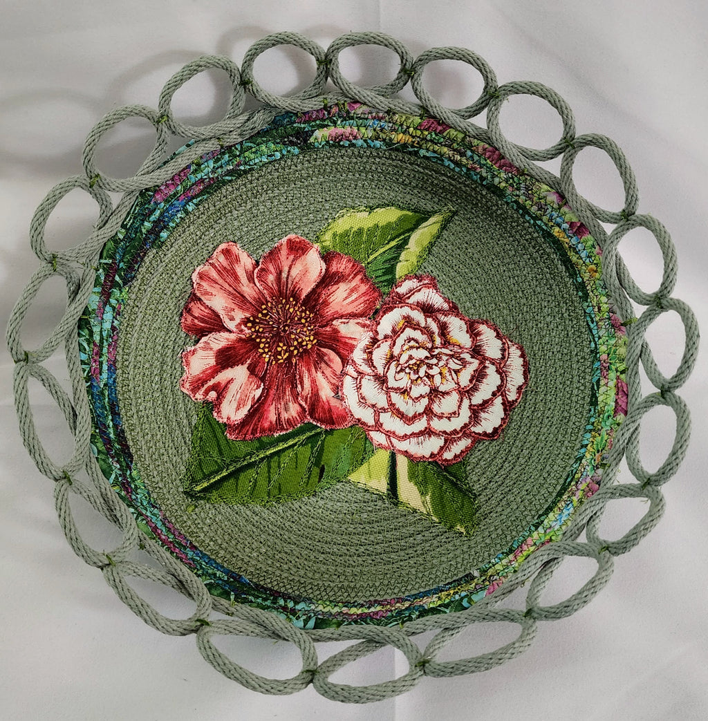 Decorative plate with floral design and green border on a white background