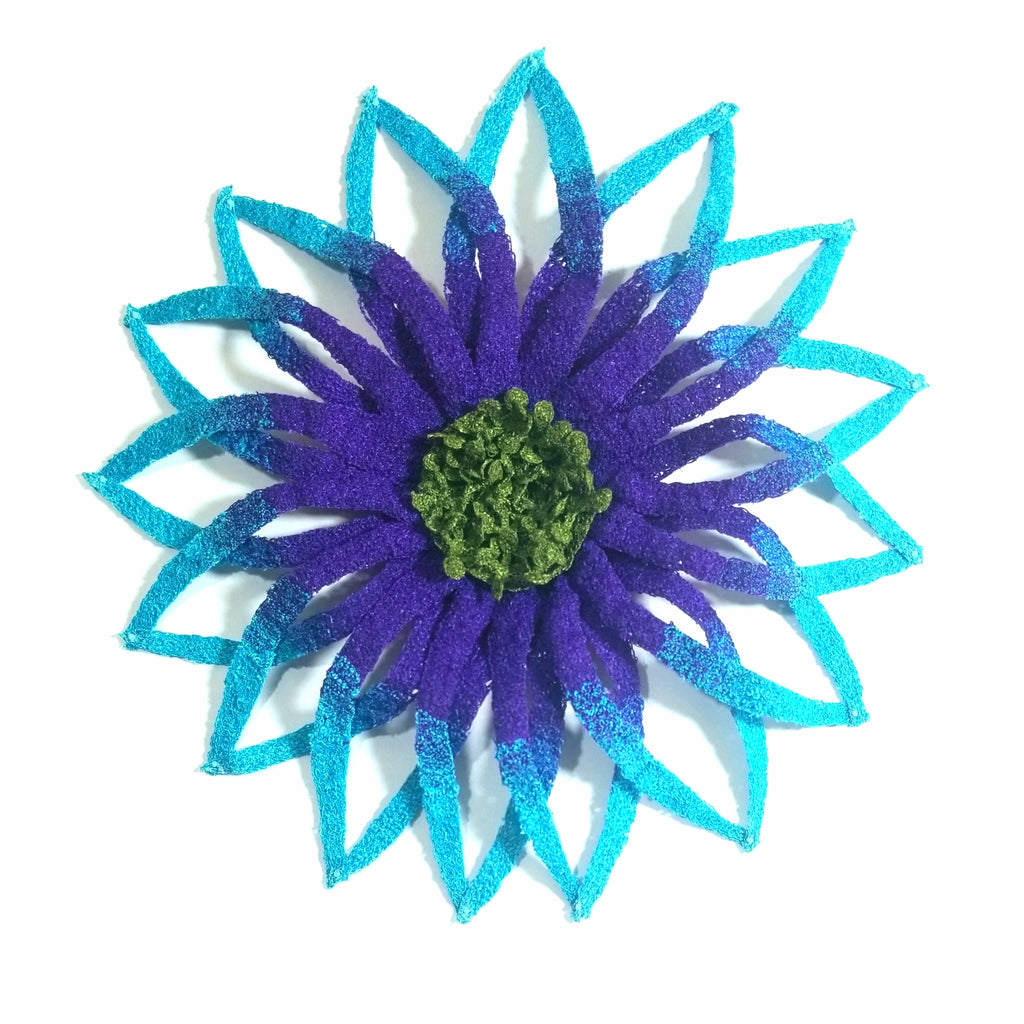 Blue and green decorative flower on a white background