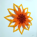 Decorative orange flower with a red center on a light blue background